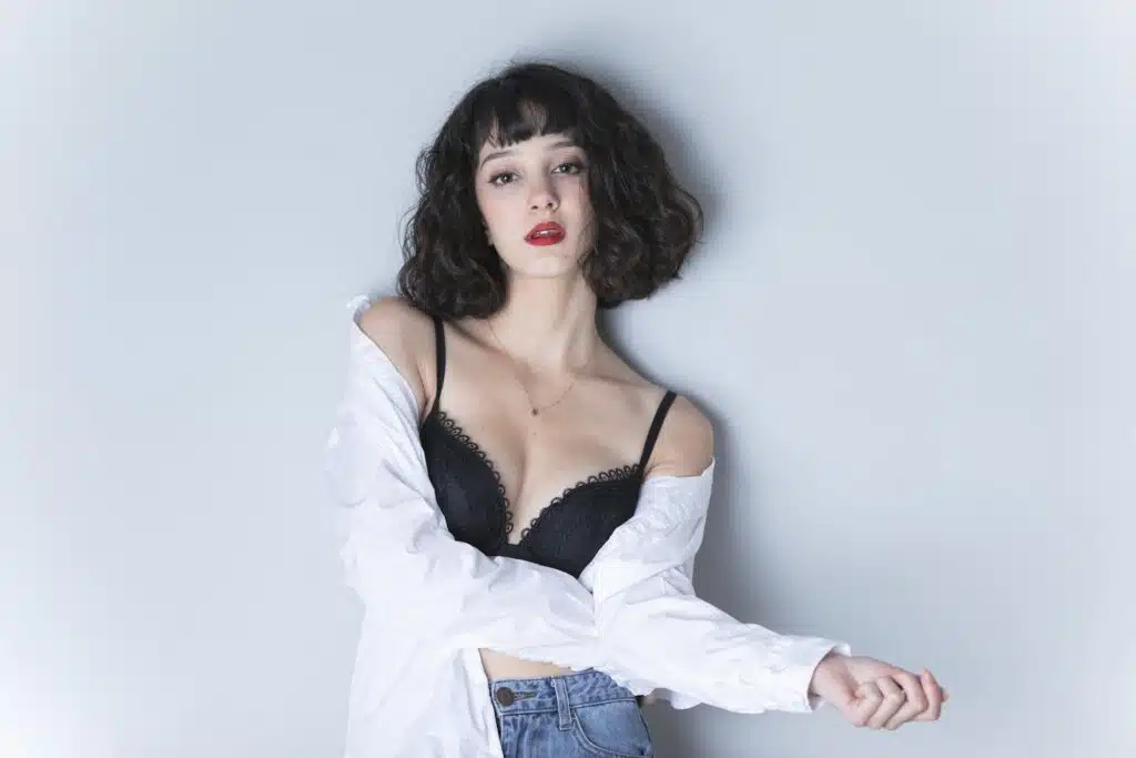 A Woman Wearing Bra and White Long sleeves